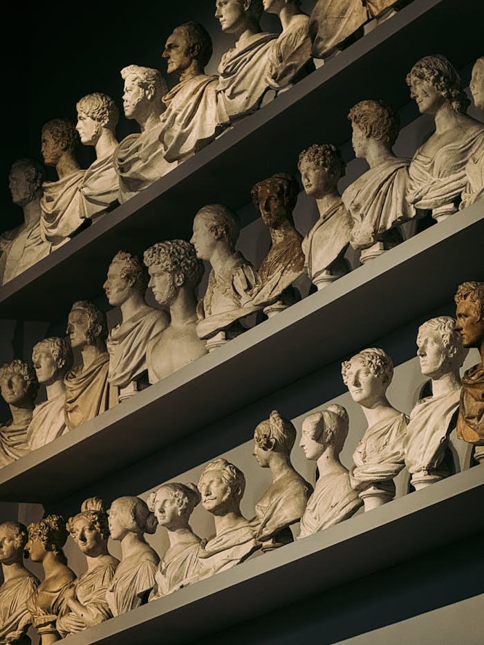about-us-02 A museum display of classical busts in Florence, Italy showcasing Roman and Greek art.